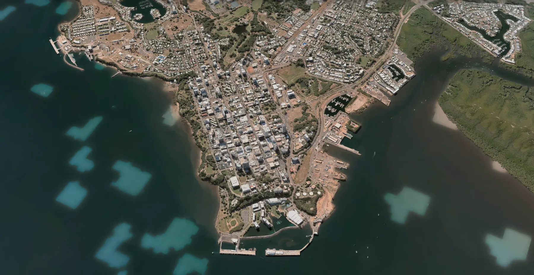 Aerial view of Darwin today — the town peninsula, Stokes Hill Wharf and the calm harbour